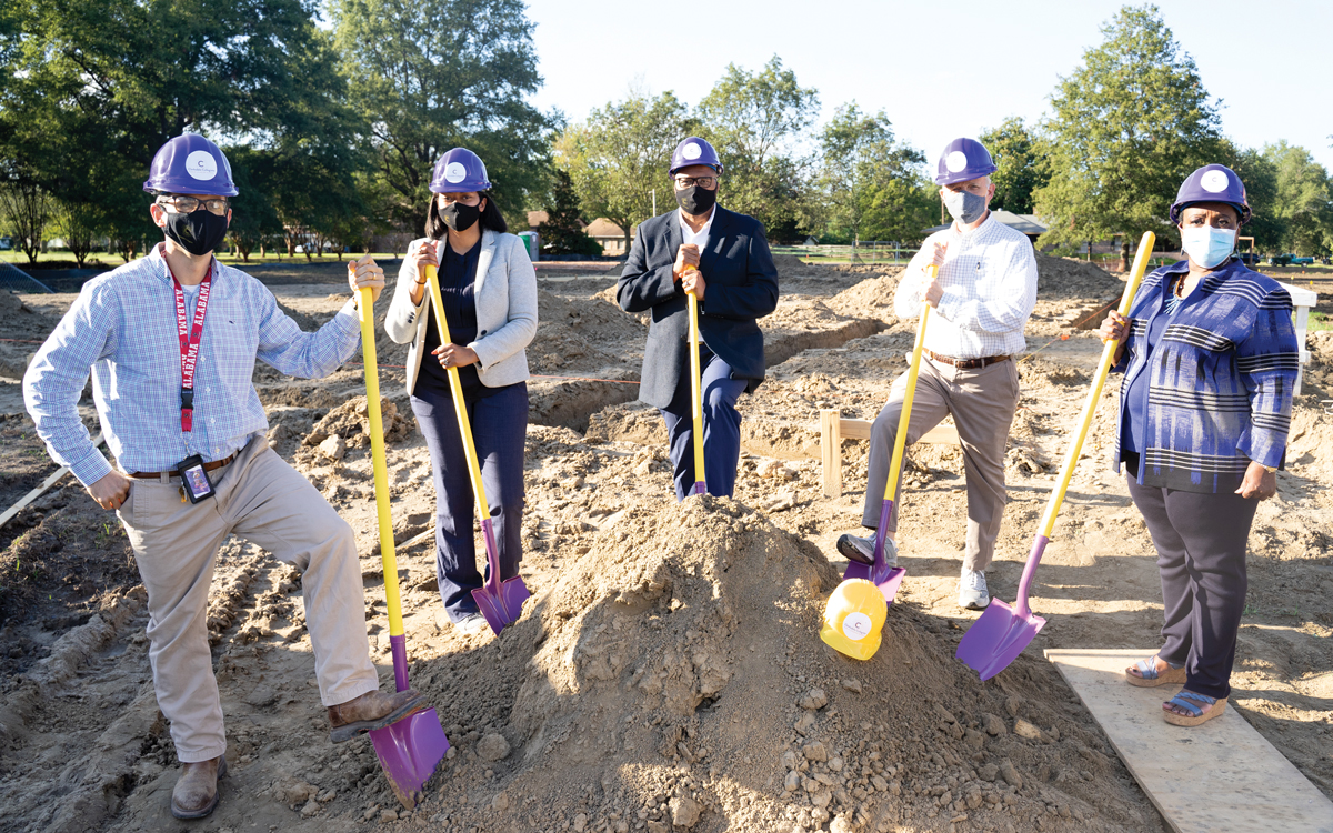 Chris Campos, from left, Amanda Johnson, Clifton Johnson, Billy Crews, Aurelia Jones-Taylor, turn a shovel of dirt at Clarksdale Collegiate Public Charter School’s groundbreaking ceremonies last week.