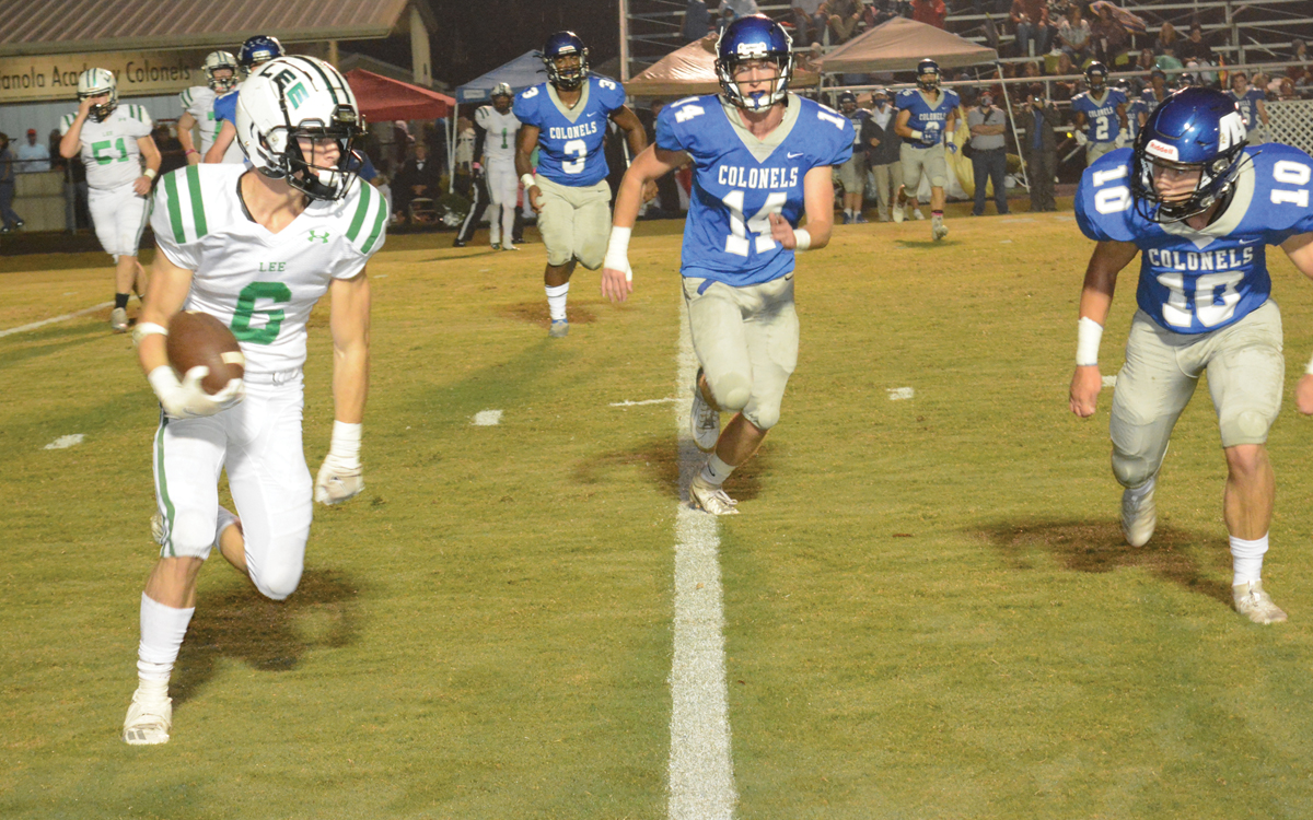 Lee running back Graydon Gullick (6) turns the corner against Indianola Academy Thursday night Oct. 8, 2020. The first quarter play earned the Colts a first down.