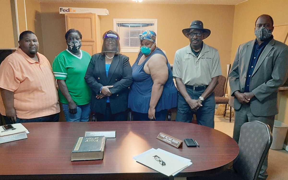 New Jonestown mayor Vivian Burnett, third from left, comes together with her board on the night she is sworn in office. Pictured are alderman Unta Wiley, from left, alderwoman Brenda D. Green, Burnett, alderwoman Yvonne Williams-Brooks, alderman Gregory Neely Sr. who served as acting mayor before Burnett took office and board attorney Derek Hopson.