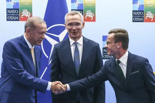 Turkey's President Recep Tayyip Erdogan, left, shakes hands with Sweden's Prime Minister Ulf Kristersson, right, as NATO Secretary General Jens Stoltenberg looks on prior to a meeting ahead of a NATO summit in Vilnius, Lithuania, Monday, July 10, 2023. The road for Sweden’s NATO membership has been bumpy, chiefly because of Turkey stalling ratifying Sweden’s application. (Yves Herman, Pool Photo via AP, File)