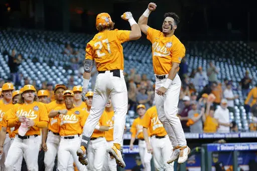 Tennessee's Jordan Beck (27) and Jorel Ortega, right, jump in celebration of Beck's home run against Oklahoma during an NCAA baseball game on Sunday, March 6, 2022, in Houston. After finishing one of the most dominant runs in Southeastern Conference history, Tennessee was named the No. 1 overall seed in the NCAA baseball tournament Monday, May 30, 2022. (AP Photo/Michael Wyke, File)