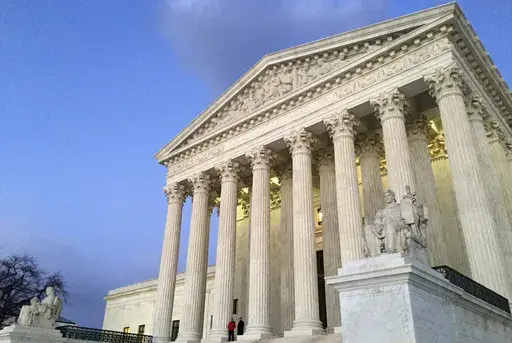 The Supreme Court at sunset in Washington, Feb. 13, 2016. (AP Photo/Jon Elswick, File)