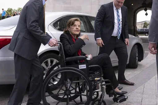 Sen. Dianne Feinstein, D-Calif., is assisted to a wheelchair by staff as she returns to the Senate after a more than two-month absence, at the Capitol in Washington, Wednesday, May 10, 2023. Feinstein's ongoing medical struggles have raised a sensitive political question with no easy answer: Who would California Democratic Gov. Gavin Newsom pick to replace her if the seat became vacant? (AP Photo/J. Scott Applewhite, File)