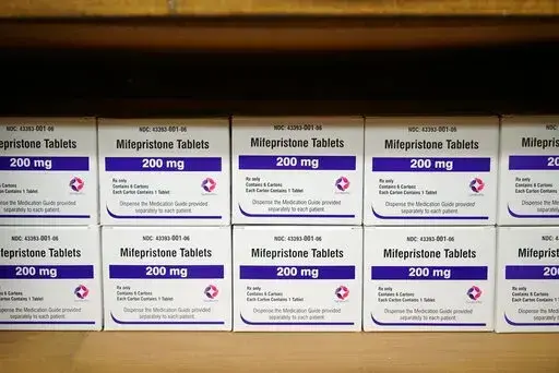 Boxes of the drug mifepristone line a shelf at the West Alabama Women's Center in Tuscaloosa, Ala., on Wednesday, March 16, 2022. The drug is one of two used together in "medication abortions."   On Friday, June 17,  The Associated Press reported on stories circulating online incorrectly claiming medication abortions are dangerous.  (AP Photo/Allen G. Breed, File)