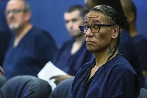 Nathan Chasing Horse sits in court, April 3, 2023, in Las Vegas. The former "Dances with Wolves" actor has been charged in Alberta, Canada, with sexual assault and sexual exploitation. The new charges come months after Chasing Horse was arrested by Las Vegas police and indicted in a sweeping sexual abuse case accusing him of crimes spanning two decades, multiple states and two countries. He now faces criminal sexual assault charges in at least five jurisdictions. (AP Photo/Ty O'Neil, File)