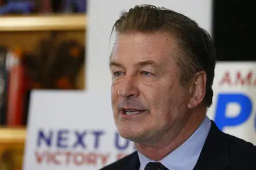 Actor Alec Baldwin, speaks to supporters of Amanda Pohl, candidate for Virginia Senate District 11 in her home in Midlothian, Va., Tuesday, Oct. 22, 2019. Prosecutors announced Thursday, Jan. 19, 2023 they are charging Baldwin with involuntary manslaughter in fatal shooting of cinematographer on movie set. (AP Photo/Steve Helber, File)
