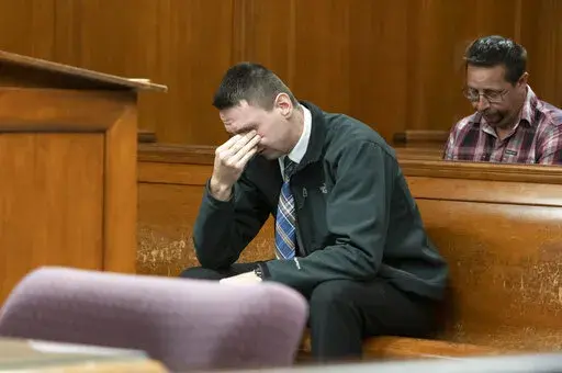 Paul Bellar awaits the verdict in his trial before Jackson County Circuit Court Judge Thomas Wilson on Wednesday, Oct. 26, 2022, at the Jackson County Courthouse in Jackson, Mich.  Bellar, Joseph Morrison and Pete Musico are accused of being involved in a plot to kidnap Michigan Gov. Gretchen Whitmer. The three were found guilty of one felony count each of gang membership, providing material support for terrorist acts and felony firearms. (J. Scott Park/Jackson Citizen Patriot via AP, Pool)