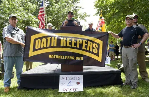 Stewart Rhodes, founder of the citizen militia group known as the Oath Keepers, center, speaks during a rally outside the White House in Washington, on June 25, 2017. The seditious conspiracy case filed this week against members and associates of the far-right Oath Keepers militia group marked the boldest attempt so far by the government to prosecute those who attacked the U.S. Capitol during the Jan. 6 riot. (AP Photo/Susan Walsh, File)