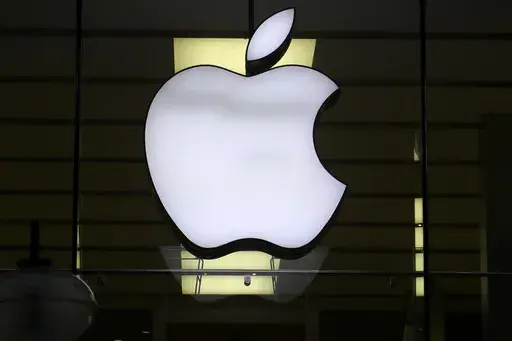 The Apple logo is illuminated at a store in the city center of Munich, Germany, Dec. 16, 2020. A potential redesign of two Apple Watch models, the Series 9 and Ultra 2, that would exclude the blood oxygen sensor has been approved by the U.S. Customs and Border Protection, according to a Monday, Jan. 15, 2024, court filing by Masimo, a Southern California company pursuing the patent claim. (AP Photo/Matthias Schrader, File)