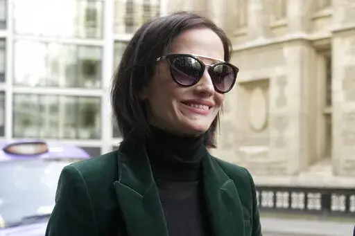 Actress Eva Green arrives at the High Court in London, Monday, Jan. 30, 2023. A lawyer for Eva Green on Thursday, Jan. 26, 2023 accused producers of a collapsed film of trying to damage the performer's reputation by depicting her as a "diva." The French actress, who played Vesper Lynd in James Bond thriller "Casino Royale," is suing producers for a $1 million fee she says she is owed for "A Patriot." (AP Photo/Kin Cheung)