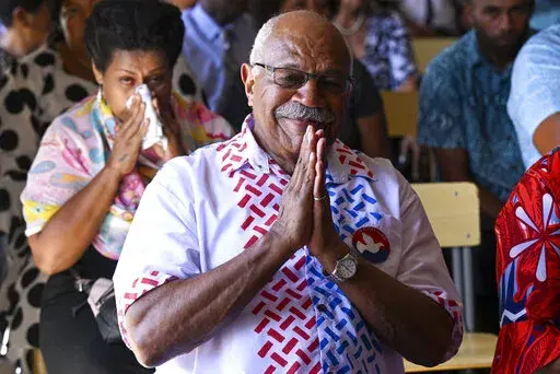People's Alliance Party leader Sitiveni Rabuka gestures during a church service at the Fijian Teachers Association Hall in Suva, Fiji, Sunday, Dec. 18, 2022. Fijian police on Thursday, Dec. 22, 2022 said they were calling in the military to help maintain security following a close election last week that is now being disputed.(Mick Tsikas/AAP Image via AP)
