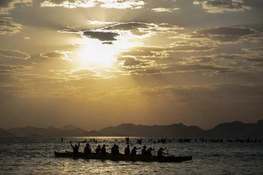 People canoe off Copacabana beach in Rio de Janeiro, Brazil at sunrise, Thursday, Aug. 24, 2023. Brazil is facing a heat wave during the southern hemisphere's winter. (AP Photo/Bruna Prado)