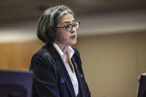 Prosecutor Kristy McDonald addresses a court in Auckland, New Zealand, on Tuesday, July 11, 2023, on the first day of a trial after a volcano eruption at a popular tourist island destination killed 22 people in December 2019. The island's owners, brothers Andrew, James and Peter Buttle, their company Whakaari Management Ltd. and tour operators I.D. Tours NZ Ltd. and Tauranga Tourism Services Ltd. went on trial in Auckland District Court for allegedly failing to adequately protect tourists and st