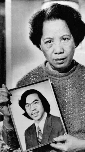 In this Nov. 2, 1983, photo, Lily Chin holds a photograph of her son Vincent, 27, who was beaten to death on June 23, 1982. Detroit is helping to honor Vincent Chin, a Chinese American man who was beaten to death 40 years ago by two white men who never served jail time. The Vincent Chin 40th Remembrance & Rededication begins Thursday, June 16, 2022, and focuses on civil rights efforts that started with his 1982 death. (AP Photo/Richard Sheinwald, File)