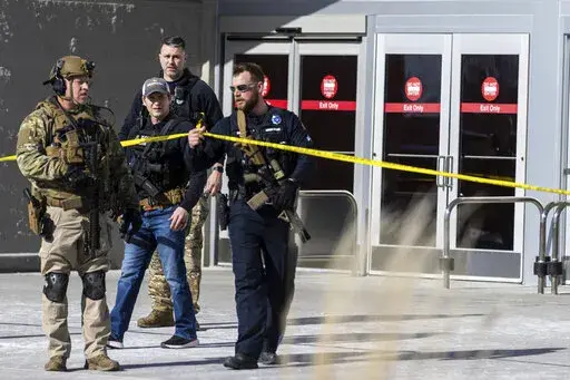 Law enforcement officers are pictured at the scene of a reported shooting at a Target store in Omaha, Neb., on Tuesday, Jan. 31, 2023. Omaha Police Chief Todd R. Schmaderer says city police confronted and shot a man with an assault rifle. (Chris Machian/Omaha World-Herald via AP)