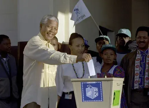 Then African National Congress leader, Nelson Mandela casts his vote April 27, 1994 near Durban, South Africa, in the country's first all-race elections. South Africans celebrate "Freedom Day" every April 27, when they remember their country's pivotal first democratic elections in 1994 that announced the official end of the racial segregation and oppression of apartheid. (AP Photo/John Parkin. File)