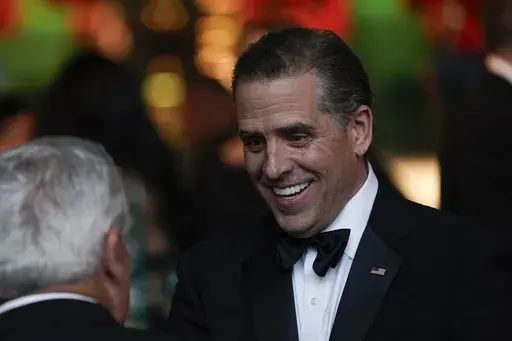 Hunter Biden talks with guests before President Joe Biden offers a toast during a State Dinner for India's Prime Minister Narendra Modi at the White House in Washington, June 22, 2023. The Republican chairmen of three key House committees are joining forces to probe the Justice Department's handling of charges against Hunter Biden after making sweeping claims about misconduct at the agency. (AP Photo/Susan Walsh)