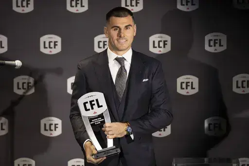 Toronto Argonauts' Chad Kelly poses with his award for Most Outstanding Player at the Canadian Football League Awards in Niagara Falls, Ontario, Thursday, Nov. 16, 2023. The CFL suspended Toronto Argonauts quarterback Chad Kelly for at least nine regular-season games Tuesday, May 7, 2024, following its investigation into a lawsuit filed by a former strength and conditioning coach against both the player and club.(Tara Walton/The Canadian Press via AP, File)