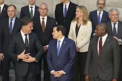 U.S. Secretary of State Marco Rubio, center, and NATO Secretary General Mark Rutte, left, poses with counterparts during a group photo of NATO foreign ministers at NATO headquarters Brussels, Thursday, April 3, 2025. (AP Photo/Jacquelyn Martin, Pool)