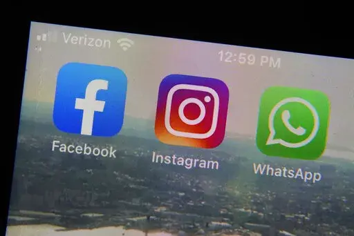 Mobile phone app logos for, from left, Facebook, Instagram and WhatsApp in are photographed in New York on Oct. 5, 2021. The seeds of misinformation about next week's midterm elections were planted in 2020. And despite efforts by tech companies to slow their spread, misleading claims about mail ballots, vote tallying and certification never went away. (AP Photo/Richard Drew, File)