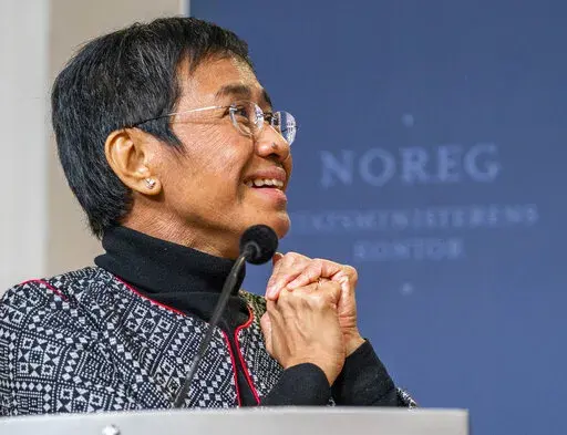 Nobel Peace Prize laureate Maria Ressa, from the Philippines, attends a news conference in Oslo, Saturday, Dec. 11, 2021. Ressa announced in a speech in Hawaii, Tuesday, June 28, 2022, that the Philippine government is affirming a previous order to shut down Rappler, the news website she co-founded, which has gained notoriety for its reporting of President Rodrigo Duterte's bloody crackdown on illegal drugs. (Hakon Mosvold Larsen/NTB scanpix via AP, File)