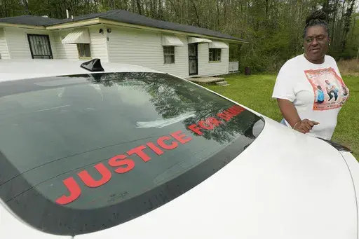 Monica Lee stands outside her eldest son's house in Braxton, Miss., March 21, 2023, as she talks about her youngest son, Damien Cameron. The 29-year-old Black man, with a history of mental illness, died in July 2021 after being arrested by two Rankin County sheriff's deputies. A civil suit can continue against a former Mississippi deputy who pleaded guilty on Aug. 3 to torturing and shooting a Black man in the mouth, with the suit alleging the former deputy is also responsible for the death of a