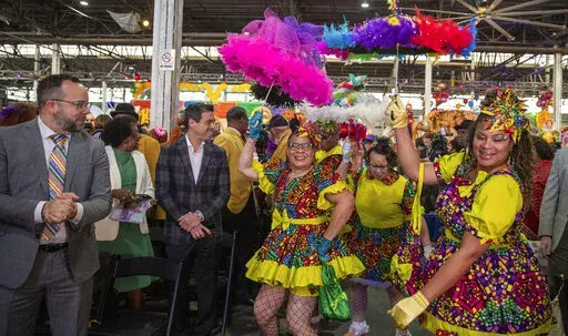 The Baby Dolls make an entrance during the King's Day celebration while kicking-off the official start of 2023 Carnival Season in New Orleans, Friday, Jan. 6, 2023. (David Grunfeld/The Times-Picayune/The New Orleans Advocate via AP)