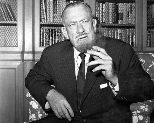 John Steinbeck talks to media in the office of his publisher in New York on Oct. 25, 1962. (AP Photo/Anthony Camerano, File)