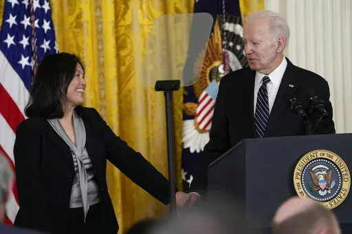 President Joe Biden talks about his nomination of Julie Su, left, to serve as the Secretary of Labor during an event in the East Room of the White House in Washington, Wednesday, March 1, 2023. (AP Photo/Susan Walsh)
