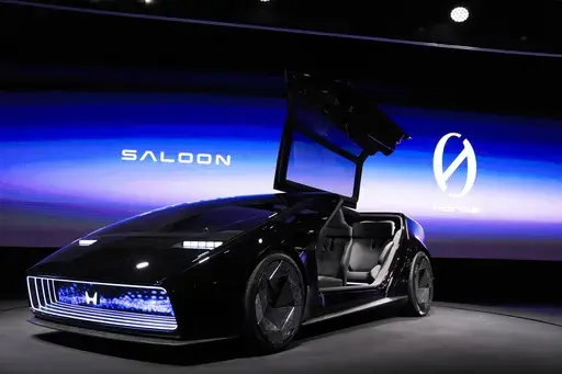 The newly unveiled concept car, Honda Zero Series "Saloon" electric vehicle is displayed during a Honda news conference during the CES tech show Tuesday, Jan. 9, 2024, in Las Vegas. Taking design cues from seemingly everything from a ground-hugging sports car to a 1980s-era Dustbuster vacuum cleaner, the Honda Saloon concept vehicle is a hint at the Japanese automaker’s EV strategy and upcoming designs. (AP Photo/Ryan Sun, File)
