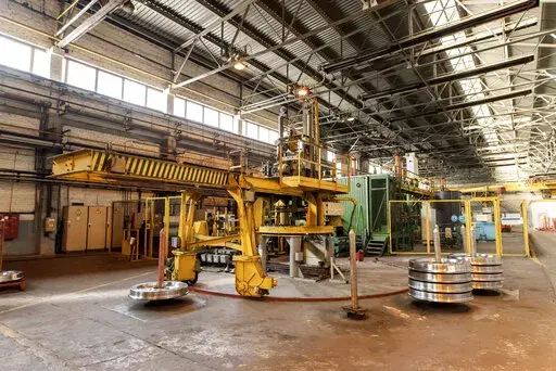 The Interpipe Steel plant in Dnipro, Ukraine, is shown, Thursday, March 10, 2022. Getting steel gas pipes to Texas oil companies and railway wheels to European high-speed train operators has been put on hold as hundreds of Interpipe’s roughly 10,000 employees in Ukraine have joined the fight against Russia. Working with a skeleton crew, some of Interpipe’s facilities are running their canteens and making metal barriers to block Russian tanks and convoys. Its bomb shelters house dozens of loc