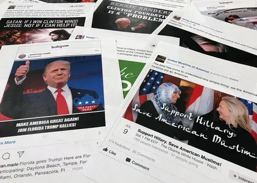 Printouts of some of the Facebook and Instagram ads linked to a Russian effort to disrupt the American political process and stir up tensions around divisive social issues, released by members of the U.S. House Intelligence committee, photographed in Washington, are photographed on Nov. 1, 2017. Federal prosecutors and lawyers for Donald Trump have signaled their desire to invoke the 2016 election in the former president's trial on charges of scheming to overturn the results of the 2020 presiden