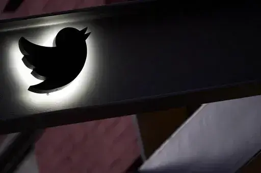 The Twitter logo is seen on the awning of the building that houses the Twitter office in New York, Wednesday, Oct. 26, 2022.  While amount of chaos is expected after a corporate takeover, as are layoffs and firings, Elon Musk’s murky plans for Twitter — especially its content moderation, misinformation and hate speech policies — are raising alarms about where one of the world’s most high-profile information ecosystems is headed.   (AP Photo/Mary Altaffer, File)