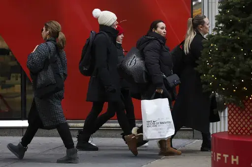 Shoppers walk along Fifth Avenue on Nov. 29, 2024, in New York. (AP Photo/Heather Khalifa, File)