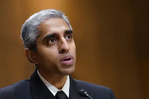 Surgeon General Dr. Vivek Murthy testifies before the Senate Finance Committee on Capitol Hill in Washington, on Feb. 8, 2022, on youth mental health care. Widespread loneliness in the U.S. is posing health risks as deadly as smoking a dozen cigarettes daily, costing the health industry billions of dollars annually, the U.S. surgeon general said Tuesday in declaring the latest public health epidemic. About half of U.S. adults say they’ve experienced loneliness, Murthy said in a new, 81-page re