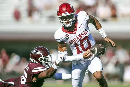 Mississippi State linebacker Zakari Tillman (16) causes Arkansas quarterback Taylen Green (10) to fumble the ball during the second half of an NCAA college football game in Starkville, Miss., Saturday, Oct. 26, 2024. Arkansas won 58-25. (AP Photo/James Pugh)