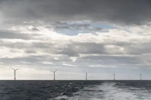 The five turbines of America's first offshore wind farm, owned by the Danish company, Orsted, are seen from a tour boat off the coast of Block Island, R.I., Oct. 17, 2022. The Biden administration said Wednesday, Feb. 22, 2023, it is considering the first-ever lease sale for offshore wind energy in the Gulf of Mexico, a key part of a push to deploy 30 gigawatts of offshore wind by 2030 to help fight climate change. (AP Photo/David Goldman, File)