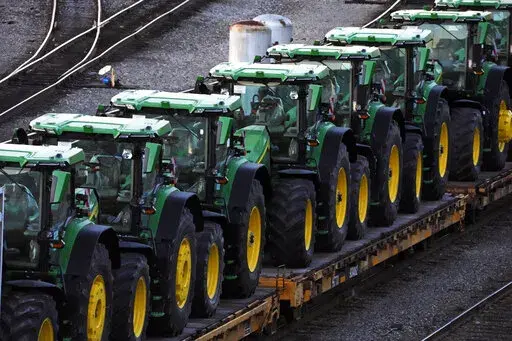 A consist of John Deere tractors sit in Norfolk Southern's Conway Yard in Conway, Pa., Monday, Dec. 5, 2022. On Thursday, the Labor Department releases the producer price index for January, an indicator of inflation at the wholesale level that's closely monitored by the Federal Reserve. (AP Photo/Gene J. Puskar, File)