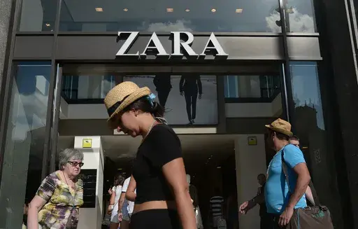 People walk past a Zara store in Barcelona, Spain, Aug. 27, 2014. The Spanish fashion brand Zara has pulled advertising images that to some appeared to reference Israel’s war against Hamas in Gaza. (AP Photo/Manu Fernandez, File)