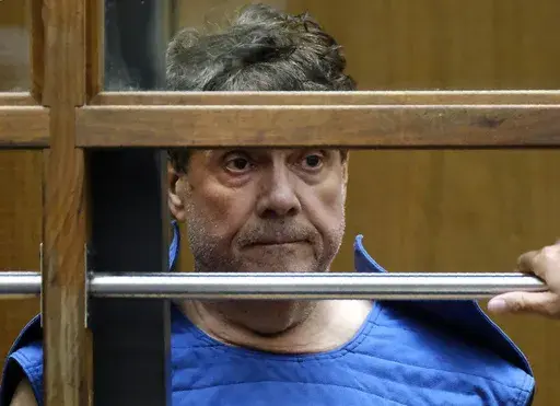 Dr. George Tyndall listens during his arraignment at Los Angeles Superior court in Los Angeles on July 1, 2019. Tyndall, the former University of Southern California gynecologist charged with sexually assaulting numerous students was found dead in his home on Wednesday, Oct. 4, 2023, according to his lawyer. (AP Photo/Richard Vogel, File)