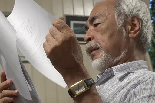 In this undated photo provided by Arai via the Ramon Magsaysay Award Foundation, 2024 Ramon Magsaysay Awardee, Japan's Miyazaki Hayao, reads a script. (Arai/Ramon Magsaysay Awards Foundation via AP)