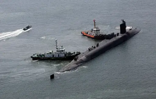 The nuclear-powered submarine USS Michigan approaches a naval base in Busan, South Korea, Friday, June 16, 2023. The United States deployed the nuclear-powered submarine capable of carrying about 150 Tomahawk missiles to South Korea on Friday, a day after North Korea resumed missile tests in protest of the U.S.-South Korean live-fire drills. (Gang Duck-chul/Yonhap via AP)