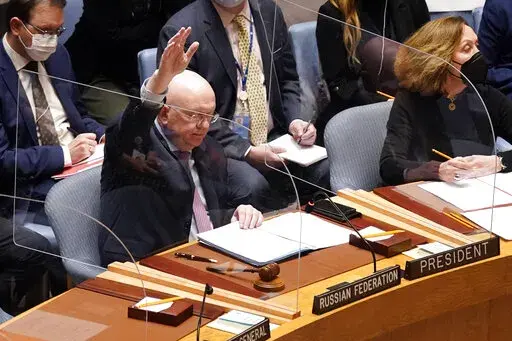 Russia's U.N. Ambassador Russia Vasily Nebenzya casts the lone dissenting vote in the United Nations Security Council, Friday, Feb. 25, 2022. Two days into Russia's attack on Ukraine, a majority of U.N. Security Council members voted to demand that Moscow withdraw. But one thing stood in their way: a veto by Russia itself. Proposals to change the council's structure or rein in the use of vetoes have sputtered for years. But this time, a new approach appears to be gaining some traction. (AP Photo