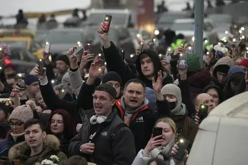 People walk toward the Borisovskoye Cemetery for the funeral ceremony of Russian opposition leader Alexei Navalny, in Moscow, Russia, Friday, March 1, 2024. After Navalny died last month in an Arctic penal colony, his allies quickly returned to work undermining Vladimir Putin's 24-year grip on power. (AP Photo, File)