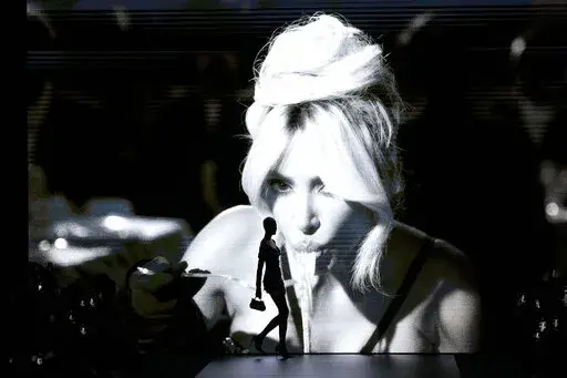 A model wears a creation as part of the Dolce & Gabbana women's Spring Summer 2023 collection presented in Milan, Italy, Saturday, Sept. 24, 2022. (AP Photo/Antonio Calanni)