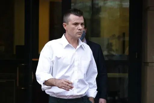 Igor Danchenko leaves the Albert V. Bryan United States Courthouse in Alexandria, Va., Nov. 4, 2021. Danchenko, a think tank analyst who played a major role in the creation of a flawed report about former President Donald Trump, is scheduled to go on trial Tuesday, Oct. 11, 2022, for lying to the FBI about how he developed information that went into what is now infamously known as the “Steele dossier.” (AP Photo/Manuel Balce Ceneta, File)