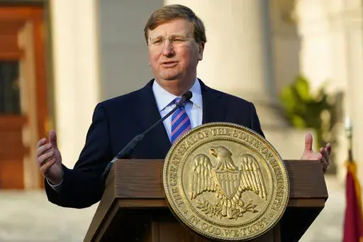 Gov. Tate Reeves outlines his priorities during his State of the State address before a joint session of the Legislature on the steps of the Mississippi State Capitol in Jackson, Miss., Tuesday, Jan. 25, 2022. (AP Photo/Rogelio V. Solis)