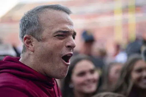 South Carolina head coach Shane Beamer celebrates after defeating Clemson in an NCAA college football game Saturday, Nov. 30, 2024, in Clemson, S.C. (AP Photo/Jacob Kupferman)