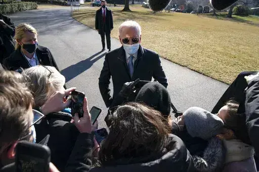 President Joe Biden talks with reporters after arriving on the South Lawn of the White House, on Feb. 8, 2021, in Washington. (AP Photo/Evan Vucci, File)