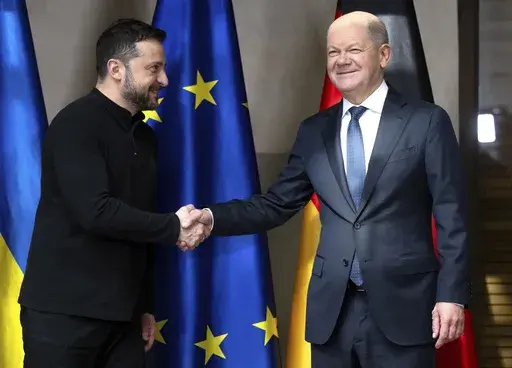 Germany's Chancellor Olaf Scholz, right and Ukraine's President Volodymyr Zelenskyy, meet for talks at the Munich Security Conference, in Munich, Germany, Saturday, Feb.15, 2025. (Sven Hoppe/DPA via AP, Pool)